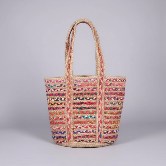 Multicolored woven tote bag on a gray background