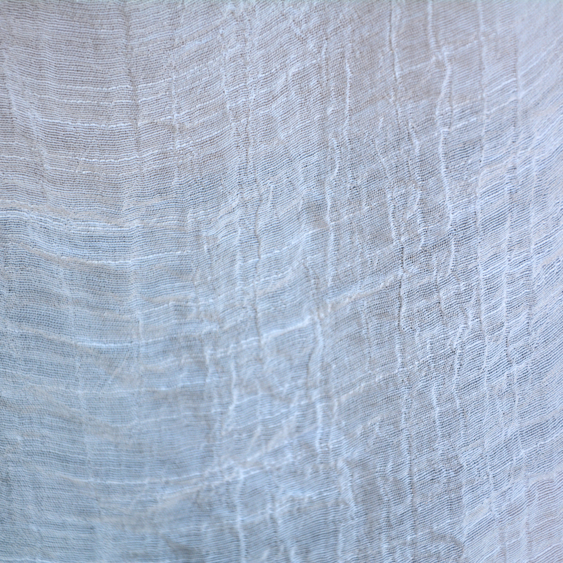 Close up of Bette moorea cover up material in white