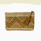 woven pouch in gold and ivory with zig zags and gold tassel