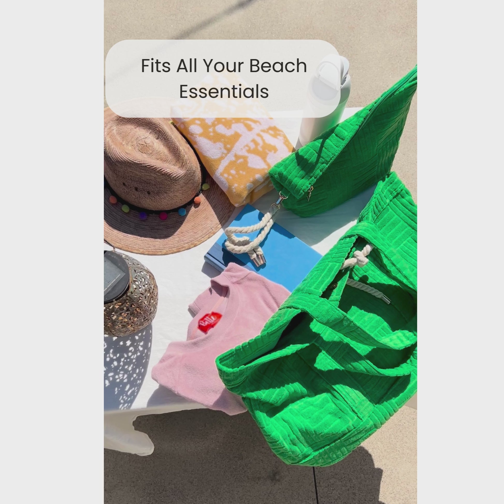 Video of someone packing a green terry cloth tote for the beach