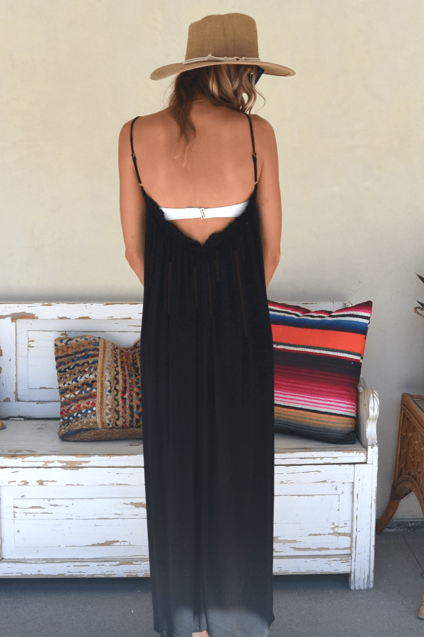 Back view of woman wearing Amalie black cover up dress.