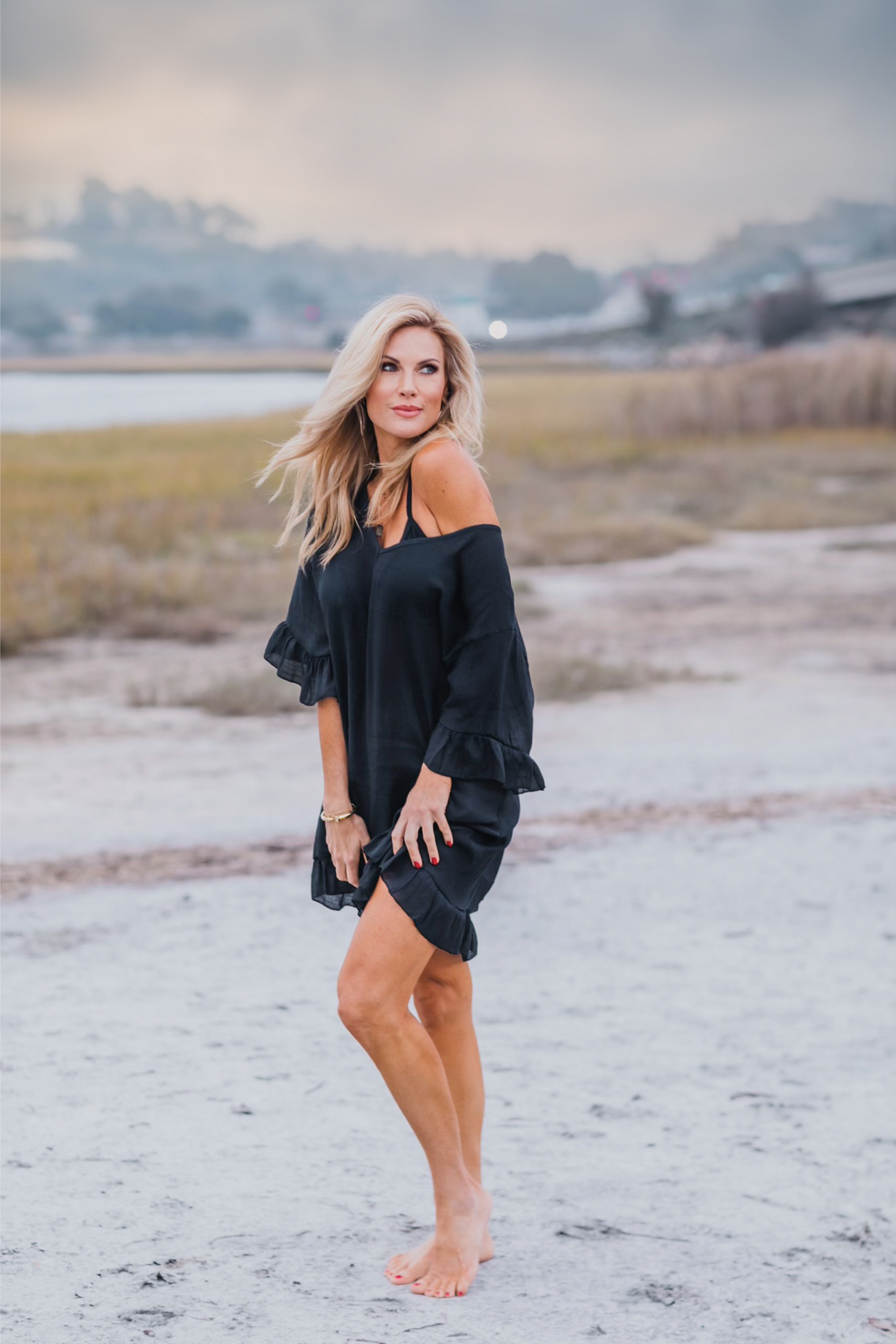 Woman at beach wearing Moorea Coverup - Black - Bette